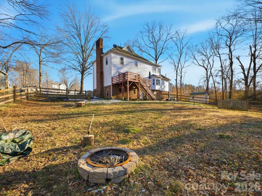 109 Elk Court, Mount Holly, NC 28120.  MLS# CAR4344317, YatesRealty ID 4662. Fire put inside of fenced in backyard
