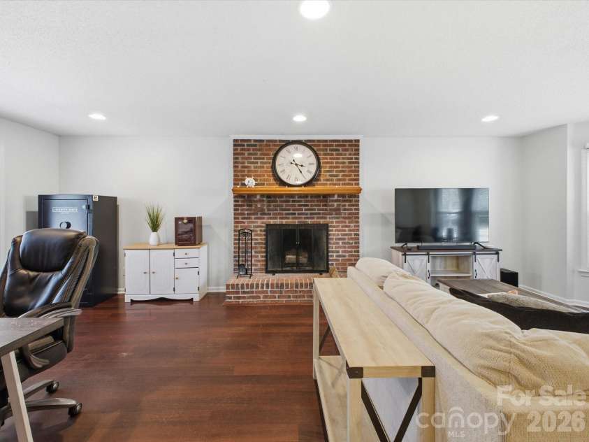 109 Elk Court, Mount Holly, NC 28120.  MLS# CAR4344317, YatesRealty ID 4662. Living room on main floor with wood burning fire place