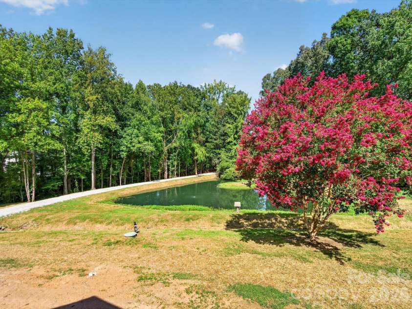 2532 Sam Newell Road, Matthews, NC 28105.  MLS# CAR4416566, YatesRealty ID 46630. Expansive yard, beautiful surroundings.