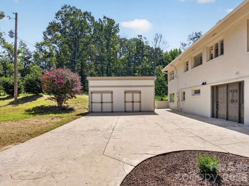 2532 Sam Newell Road, Matthews, NC 28105.  MLS# CAR4416566, YatesRealty ID 46630. Oversized detached  shed for workshop or storage