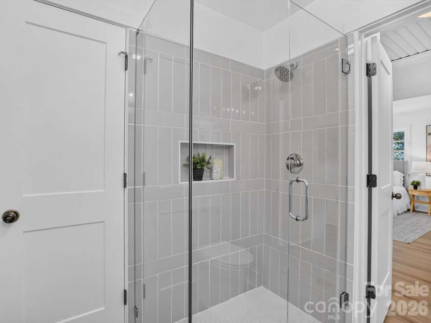2532 Sam Newell Road, Matthews, NC 28105.  MLS# CAR4416566, YatesRealty ID 46630. Sleek tile in all 3 bathrooms