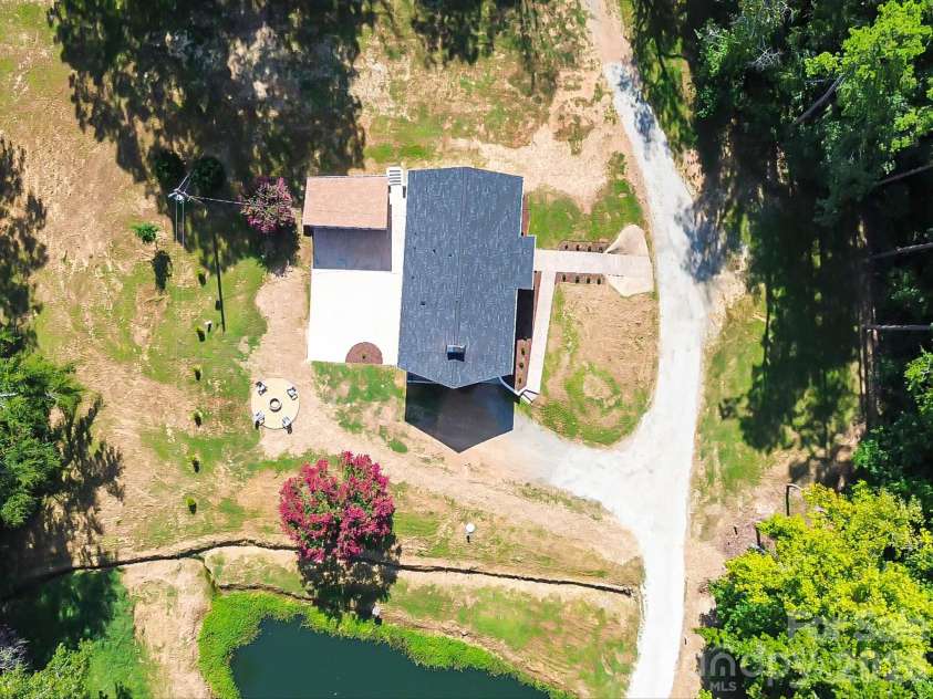 2532 Sam Newell Road, Matthews, NC 28105.  MLS# CAR4416566, YatesRealty ID 46630. Space, privacy, and a pond.