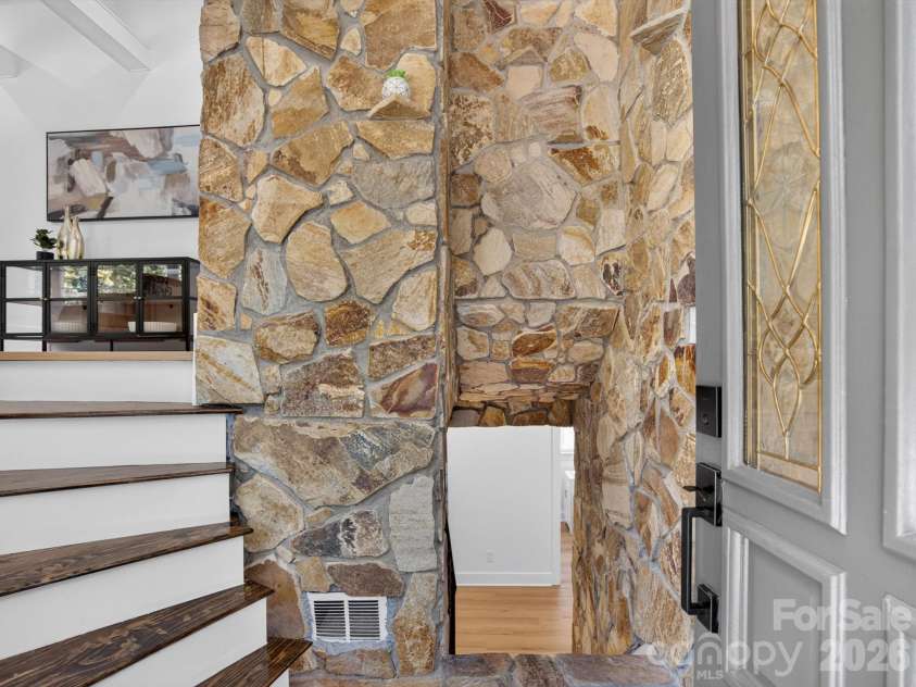 2532 Sam Newell Road, Matthews, NC 28105.  MLS# CAR4416566, YatesRealty ID 46630. Statement Stonework In the Entry