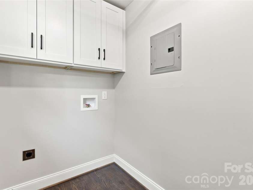 5241 Short Cut Lane, Indian Trail, NC 28079.  MLS# CAR4415304, YatesRealty ID 46636. Laundry room with extra cabinets
