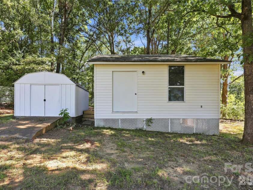 5241 Short Cut Lane, Indian Trail, NC 28079.  MLS# CAR4415304, YatesRealty ID 46636. Two outbuildings