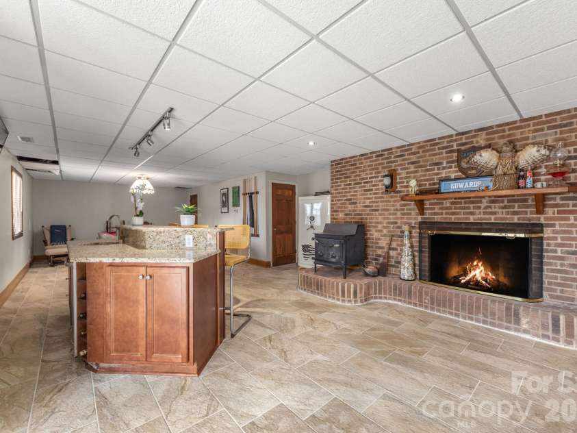151 Bridlewood Drive, Mooresville, NC 28117.  MLS# CAR4346334, YatesRealty ID 4664. Bar area with fireplace