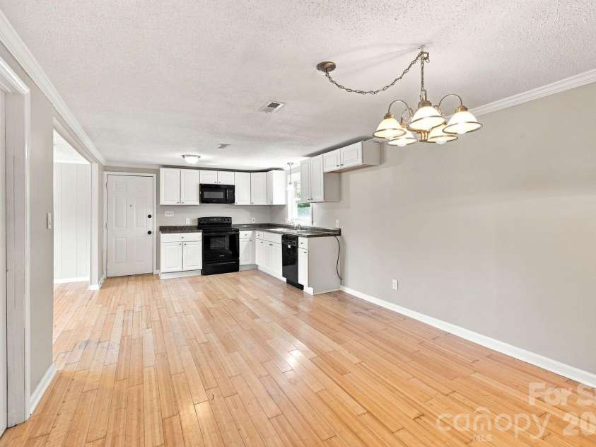 1021 Caldwell Avenue, Newton, NC 28658.  MLS# CAR4417463, YatesRealty ID 46656. Dining area looking toward the kitchen