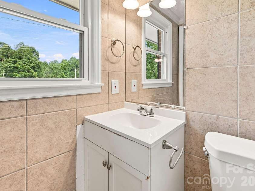 1021 Caldwell Avenue, Newton, NC 28658.  MLS# CAR4417463, YatesRealty ID 46656. Half bath