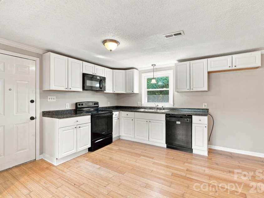 1021 Caldwell Avenue, Newton, NC 28658.  MLS# CAR4417463, YatesRealty ID 46656. Kitchen with open concept