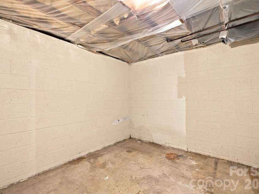 1021 Caldwell Avenue, Newton, NC 28658.  MLS# CAR4417463, YatesRealty ID 46656. Storage area in basement