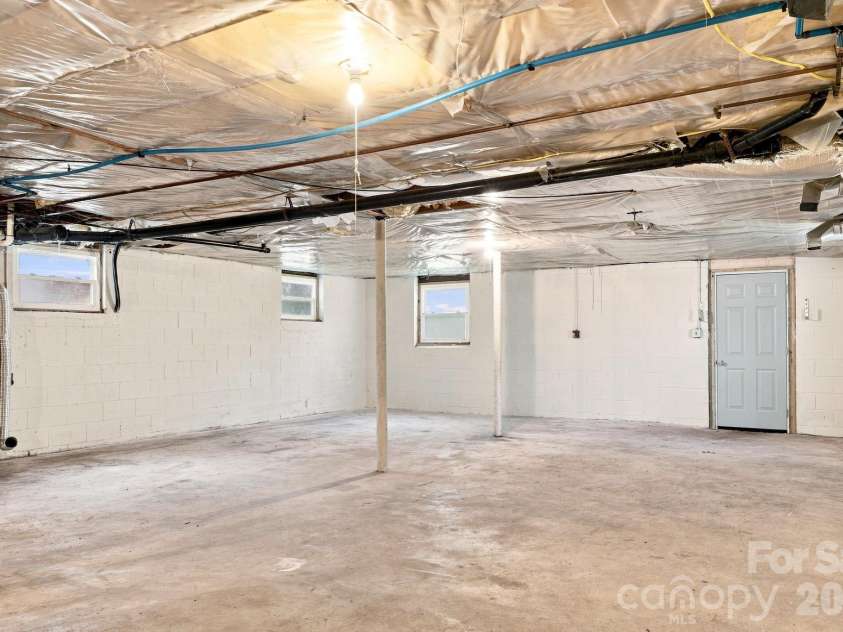 1021 Caldwell Avenue, Newton, NC 28658.  MLS# CAR4417463, YatesRealty ID 46656. Unfinished basement