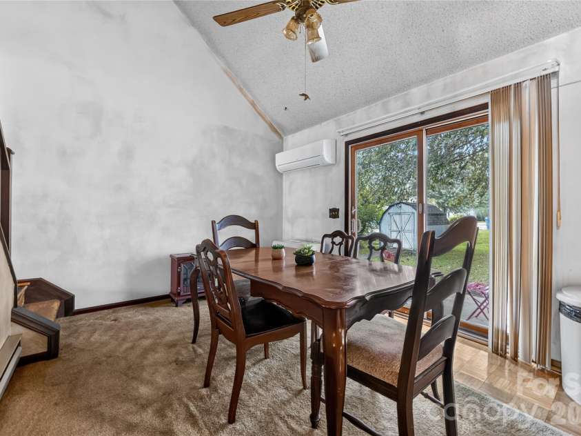 131 Spencer Street, Clyde, NC 28721.  MLS# CAR4417558, YatesRealty ID 46666. Dining room - pull out the carpet, more paint -options are endless here.