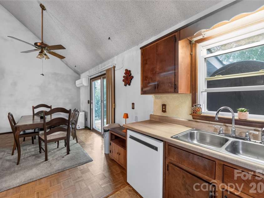 131 Spencer Street, Clyde, NC 28721.  MLS# CAR4417558, YatesRealty ID 46666. Kitchen cabinets are original but heavy plywood interior, they merely need new doors.