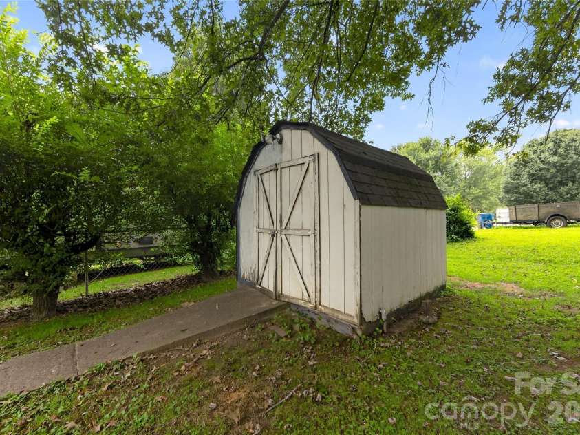 131 Spencer Street, Clyde, NC 28721.  MLS# CAR4417558, YatesRealty ID 46666. Outbuilding for your stuff.