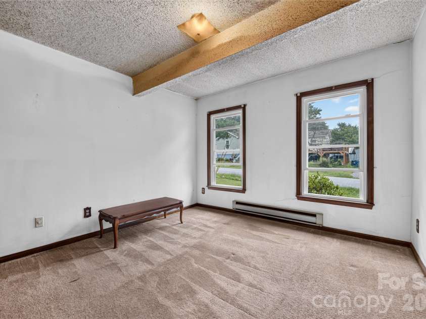 131 Spencer Street, Clyde, NC 28721.  MLS# CAR4417558, YatesRealty ID 46666. Primary Bedroom on main with bathroom en suite. Baseboards no longer work fyi