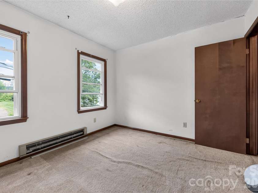 131 Spencer Street, Clyde, NC 28721.  MLS# CAR4417558, YatesRealty ID 46666. Upstairs bedroom -rip out the carpet, paint! -