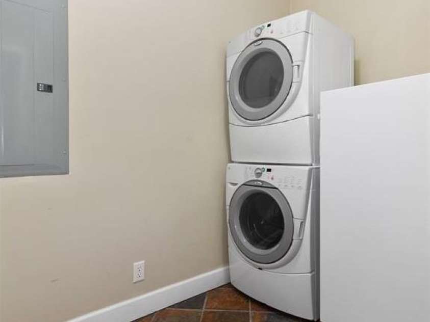 165 Sequoyah Drive, Waynesville, NC 28785.  MLS# CAR4346043, YatesRealty ID 4667. Main floor laundry room with slate flooring