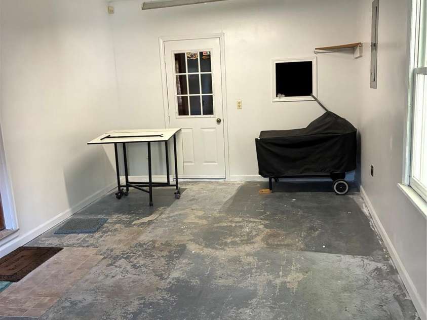 1008 Hopedale Drive, Lenoir, NC 28645.  MLS# CAR4418081, YatesRealty ID 46686. SMALL STORAGE AREA INSIDE GARAGE WITH WINDOW