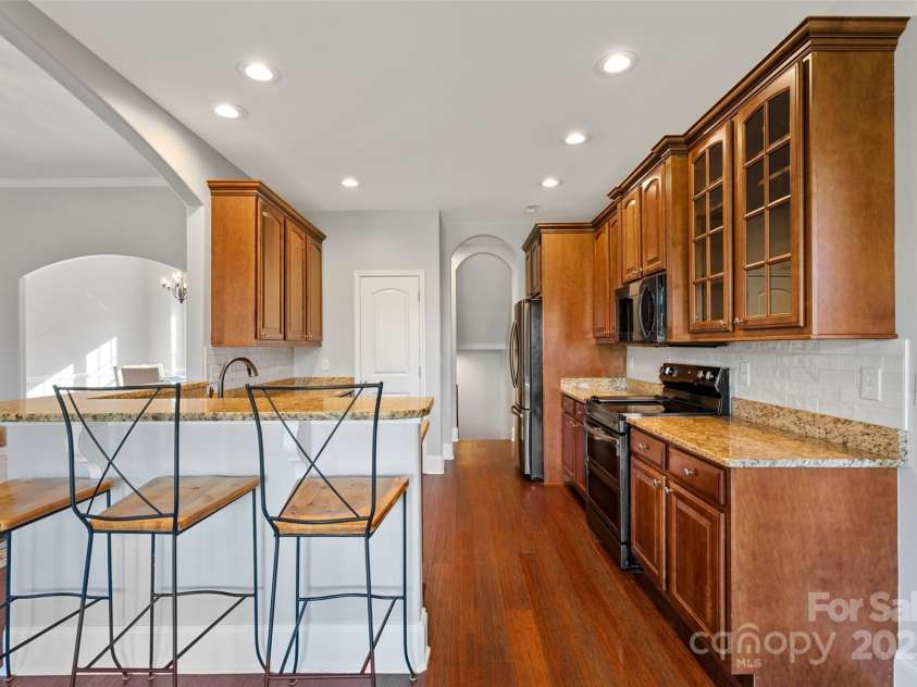 160 Fairway Falls Road, Mills River, NC 28759.  MLS# CAR4202772, YatesRealty ID 4670. Kitchen has eat in bar ideal for entertaining