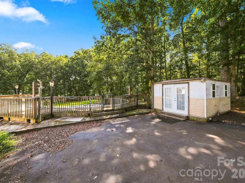 1261 Davis Road, Lincolnton, NC 28092.  MLS# CAR4404751, YatesRealty ID 46702. Small building at the house