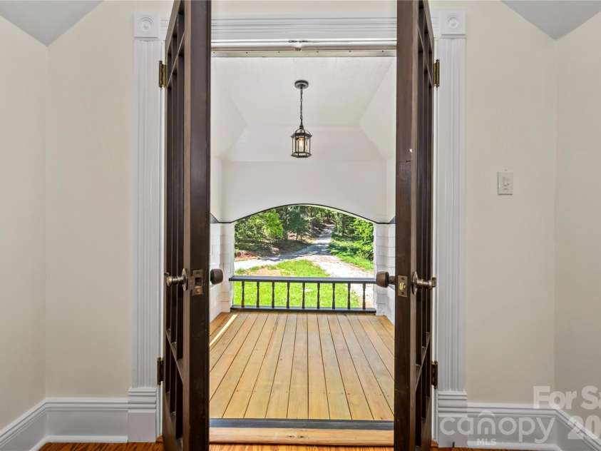 103 Hyde Avenue, Tryon, NC 28782.  MLS# CAR4416378, YatesRealty ID 46703. Balcony off Upper Level