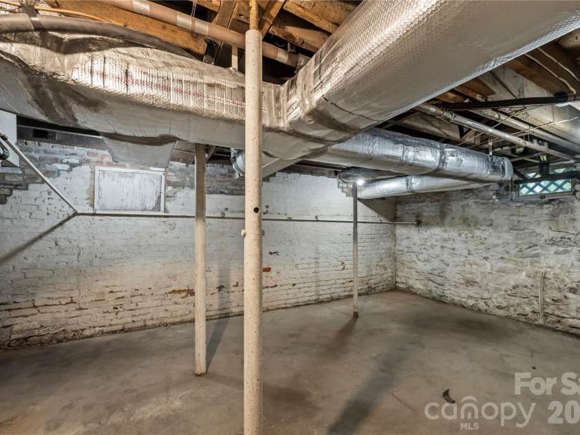 103 Hyde Avenue, Tryon, NC 28782.  MLS# CAR4416378, YatesRealty ID 46703. Basement