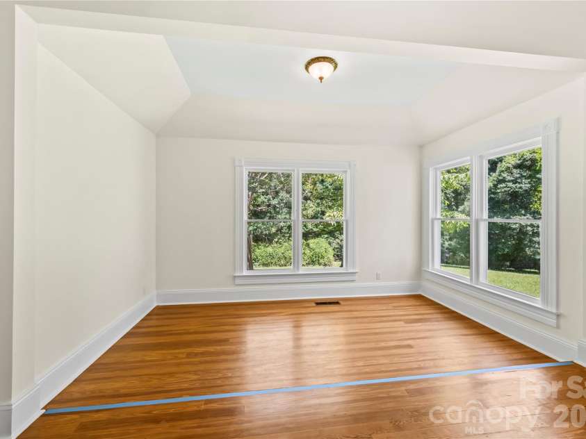 103 Hyde Avenue, Tryon, NC 28782.  MLS# CAR4416378, YatesRealty ID 46703. Bedroom #1 Sitting Area - Main Floor