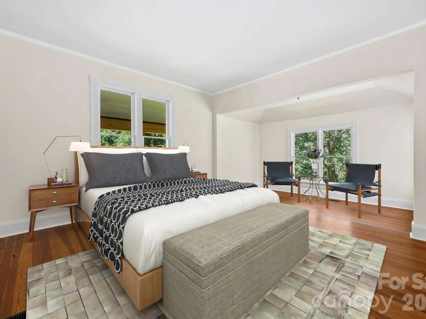 103 Hyde Avenue, Tryon, NC 28782.  MLS# CAR4416378, YatesRealty ID 46703. Bedroom with Sitting Area - Main Floor - Vitually Staged