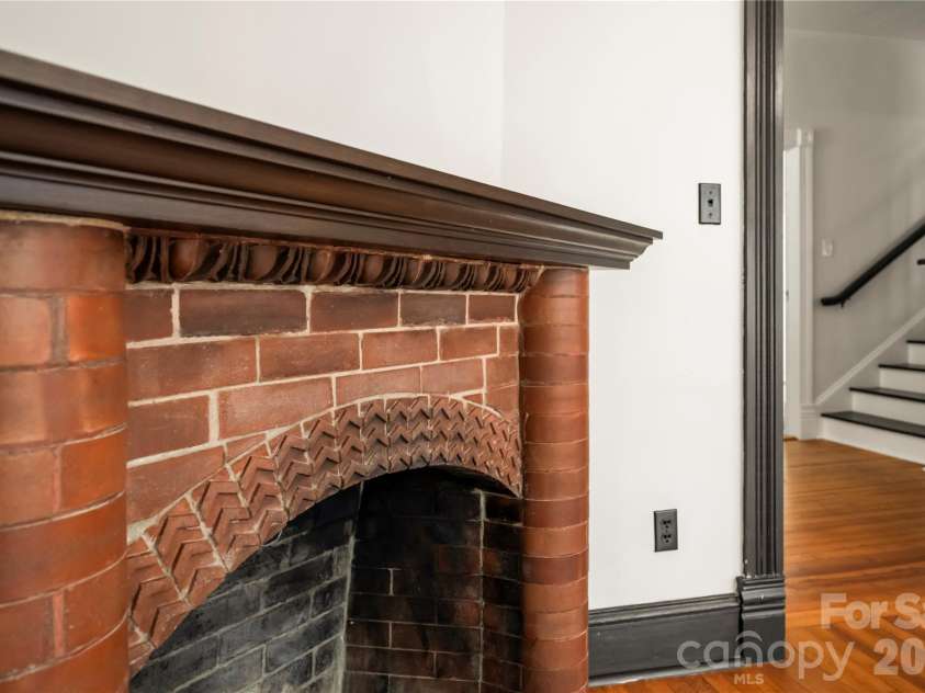 103 Hyde Avenue, Tryon, NC 28782.  MLS# CAR4416378, YatesRealty ID 46703. Fireplace Family Room - Main