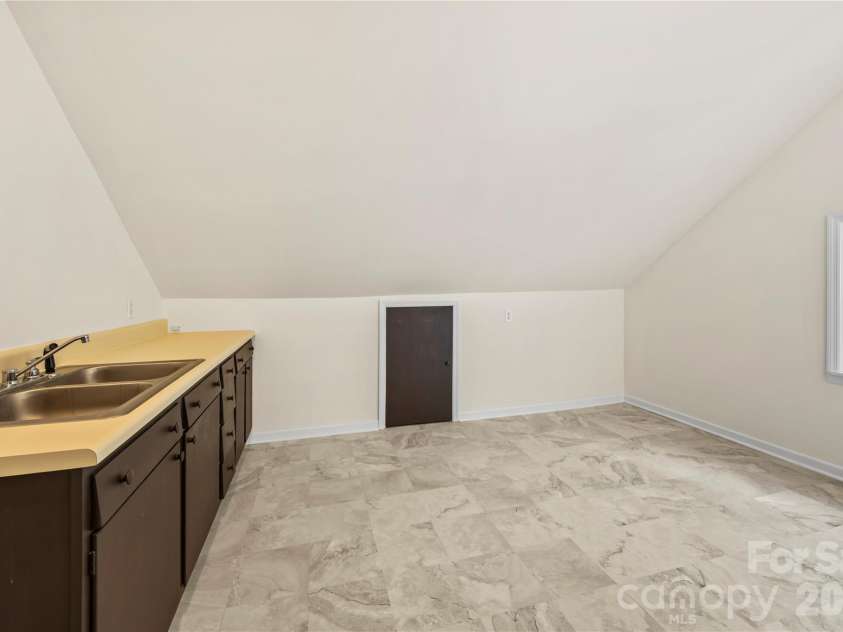 103 Hyde Avenue, Tryon, NC 28782.  MLS# CAR4416378, YatesRealty ID 46703. Laundry Room - Upper Floor