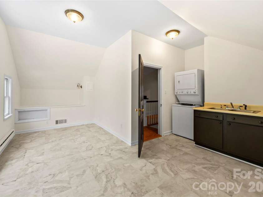 103 Hyde Avenue, Tryon, NC 28782.  MLS# CAR4416378, YatesRealty ID 46703. Laundry Room - Upper Floor