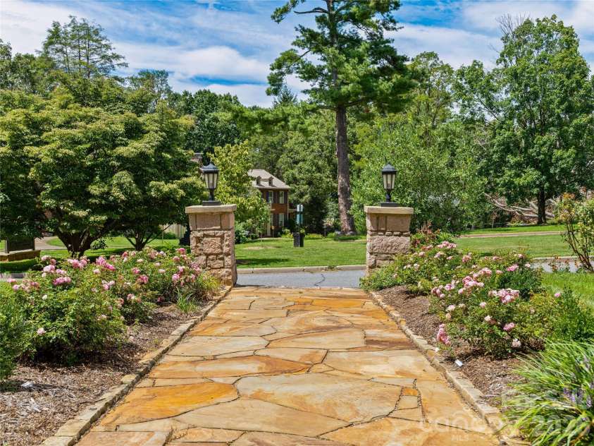 14 Griffing Boulevard, Asheville, NC 28804.  MLS# CAR4413603, YatesRealty ID 46721. Beautiful brick front walk way to the rose garden