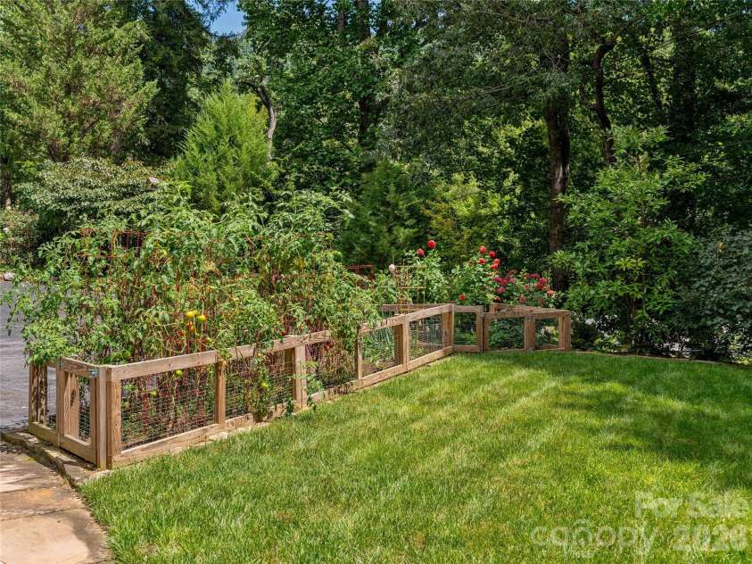 14 Griffing Boulevard, Asheville, NC 28804.  MLS# CAR4413603, YatesRealty ID 46721. Fenced vegetable garden area