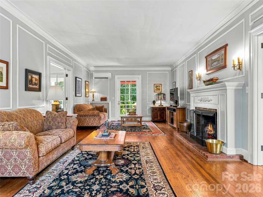 14 Griffing Boulevard, Asheville, NC 28804.  MLS# CAR4413603, YatesRealty ID 46721. Inviting living room with fireplace and classic millwork.