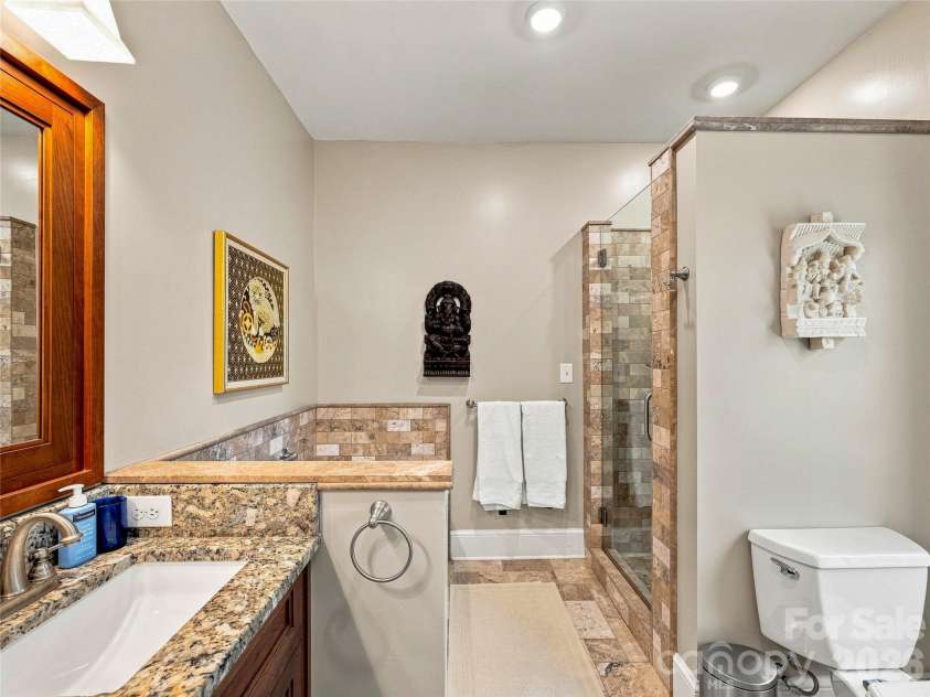 14 Griffing Boulevard, Asheville, NC 28804.  MLS# CAR4413603, YatesRealty ID 46721. Soaking tub and walk-in shower