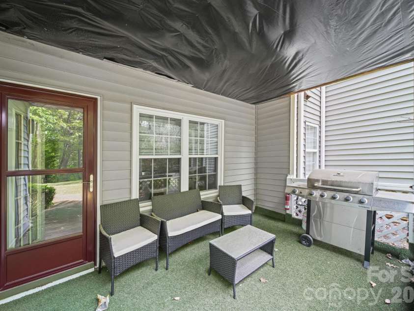 503 Gooseneck Drive, Cary, NC 27513.  MLS# CAR4418013, YatesRealty ID 46726. Back Covered Patio