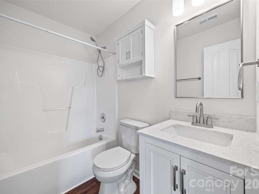 2051 Moss Creek Drive, Harrisburg, NC 28075.  MLS# CAR4344478, YatesRealty ID 4674. Shared bath features a tub/shower combo.