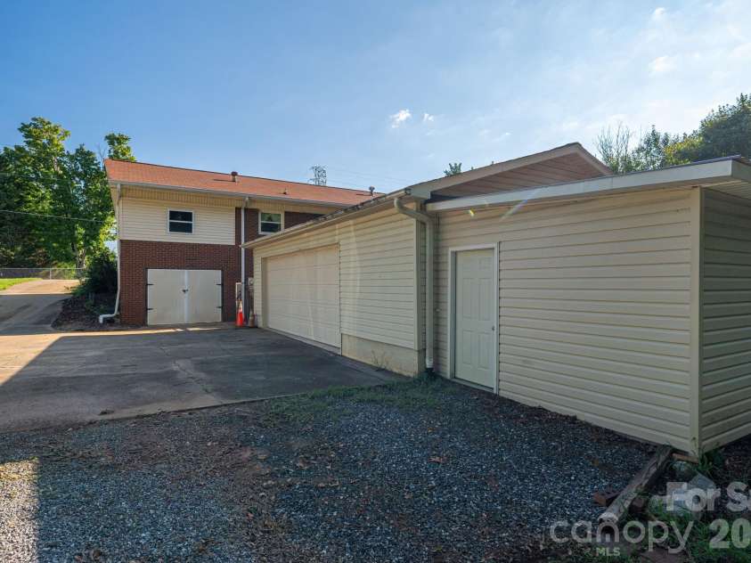 1306 11th Avenue, Hickory, NC 28602.  MLS# CAR4418185, YatesRealty ID 46742. Double garage with additional workshop