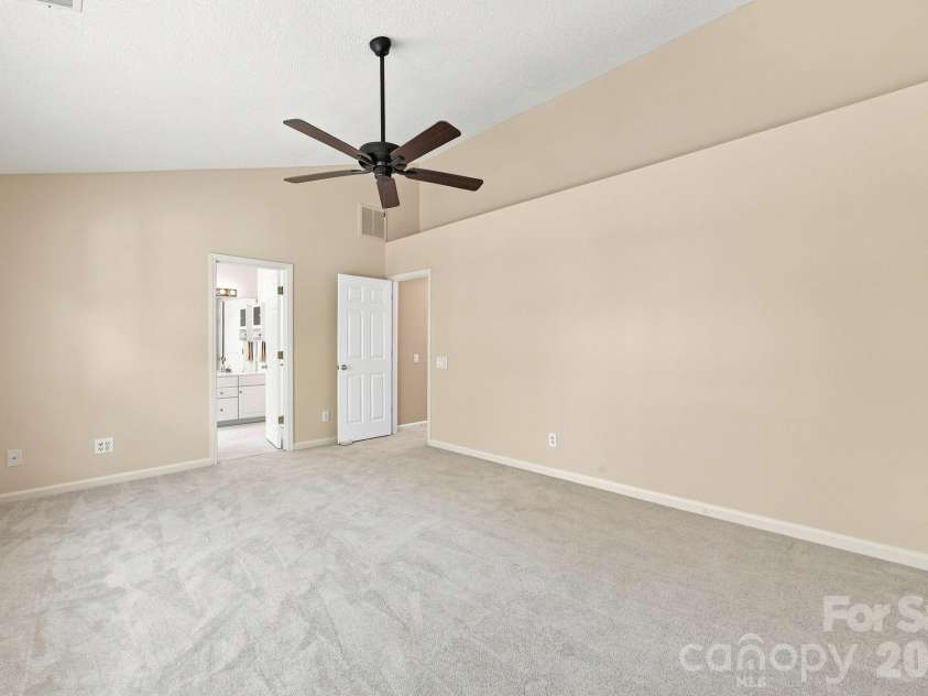 124 Aylesbury Lane, Indian Trail, NC 28079.  MLS# CAR4416136, YatesRealty ID 46745. Primary bedroom has vaulted ceiling