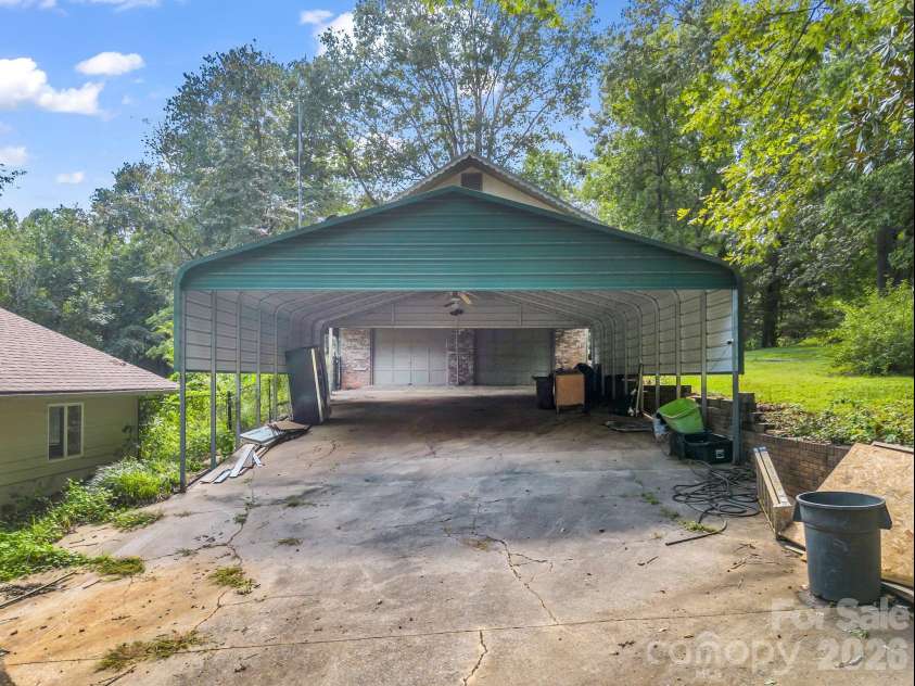 200 Woodland Circle, Rutherfordton, NC 28139.  MLS# CAR4418275, YatesRealty ID 46769. Detached Carport