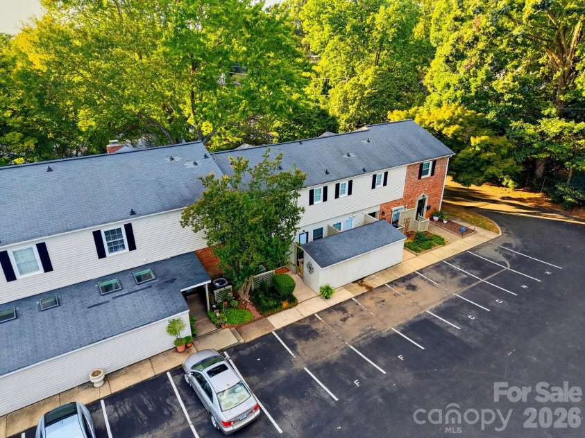 5901 Quail Hollow Road, Charlotte, NC 28210.  MLS# CAR4430297, YatesRealty ID 46771. Aerial view showing the home's setting among a mature tree canopy