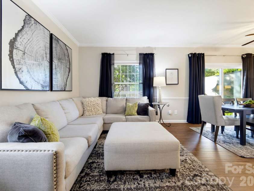5901 Quail Hollow Road, Charlotte, NC 28210.  MLS# CAR4430297, YatesRealty ID 46771. Another view highlighting the natural connection between the living and dining areas while maintaining two distinct spaces.