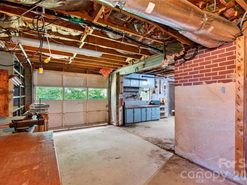 2 White Oak Road, Arden, NC 28704.  MLS# CAR4418090, YatesRealty ID 46781. Basement shop