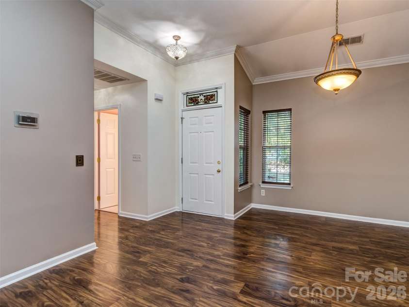 11320 Hunters Landing Drive, Charlotte, NC 28273.  MLS# CAR4426224, YatesRealty ID 46784. Open Floorplan is Perfect for Entertaining with Laminate Wood Floors, Crown Molding, & Custom Blinds