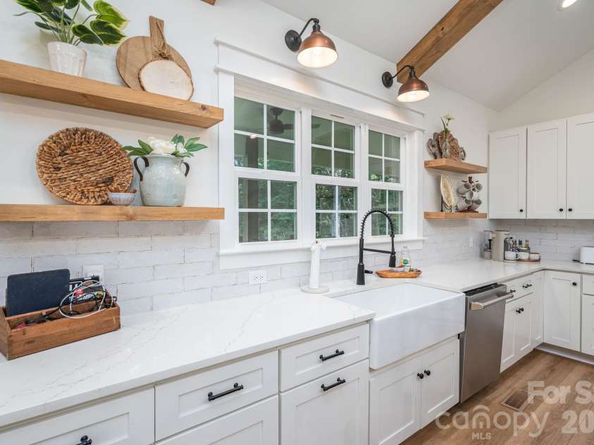 340 Whippoorwill Lane, Mount Holly, NC 28120.  MLS# CAR4417978, YatesRealty ID 46788. Ample counter space, white washed with coordinating wood accents