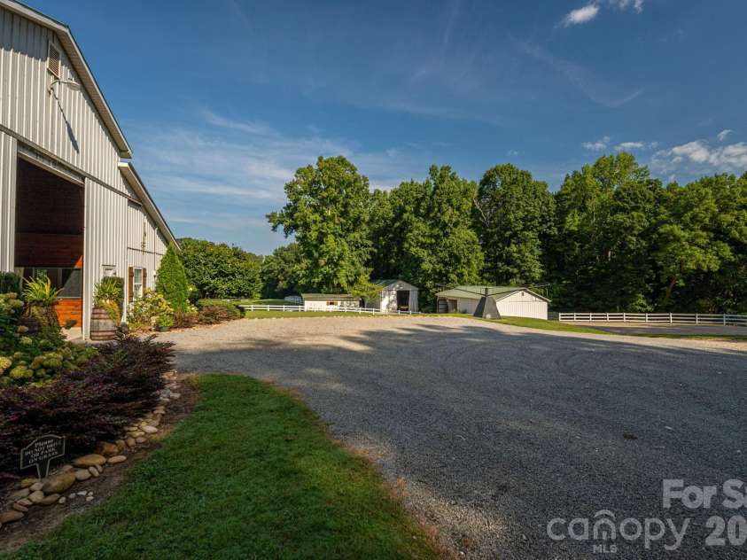 340 Whippoorwill Lane, Mount Holly, NC 28120.  MLS# CAR4417978, YatesRealty ID 46788. Barn and run-ins plus large shed that will accommodate an RV