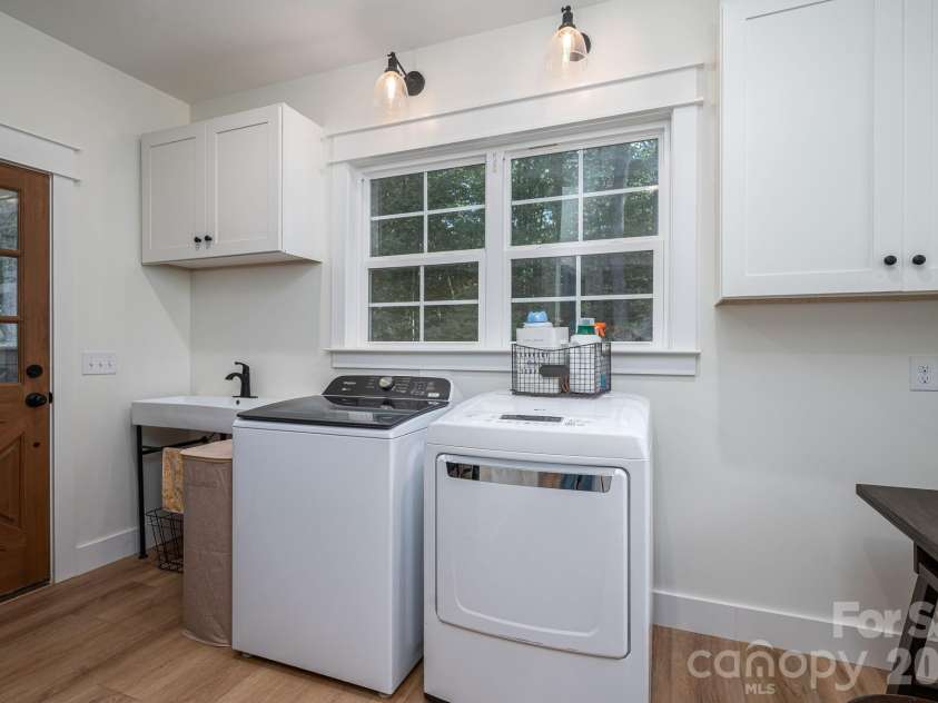 340 Whippoorwill Lane, Mount Holly, NC 28120.  MLS# CAR4417978, YatesRealty ID 46788. Laundry room with exterior access to the deck