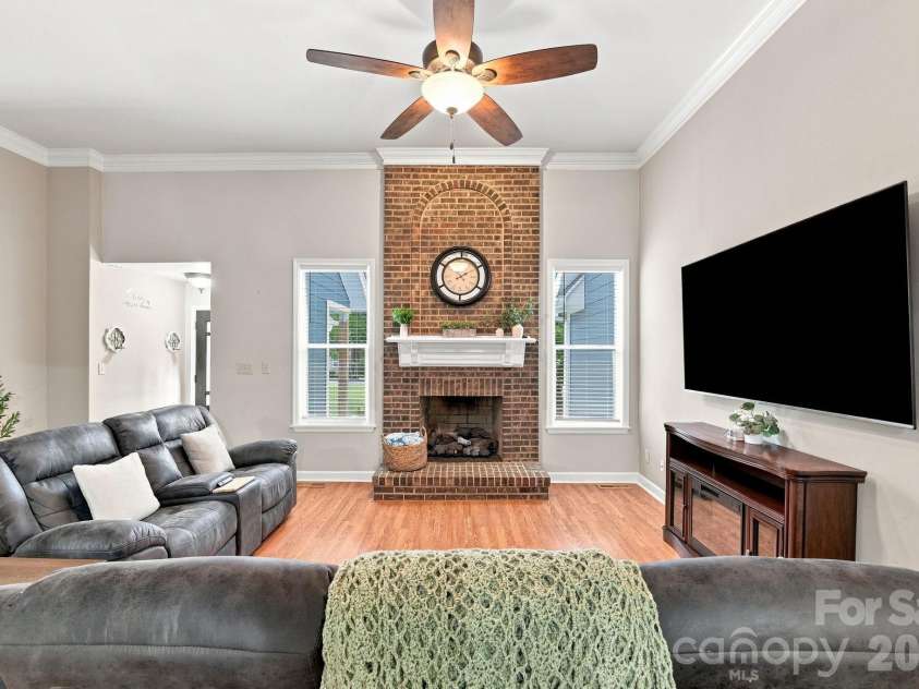 106 Webbed Foot Road, Mooresville, NC 28117.  MLS# CAR4416003, YatesRealty ID 46790. Great Room with Dramatic Floor-to-Ceiling Brick Fireplace