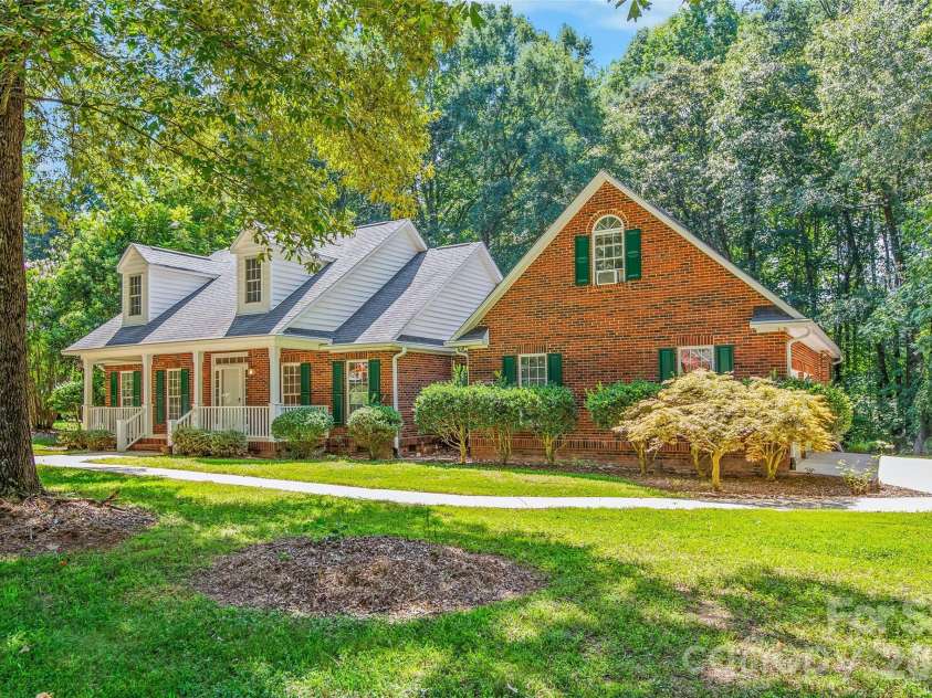 6756 Hawks Nest Lane, Stanley, NC 28164.  MLS# CAR4416084, YatesRealty ID 46791. Front elevation with side-load garage
