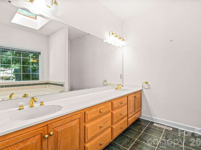 6756 Hawks Nest Lane, Stanley, NC 28164.  MLS# CAR4416084, YatesRealty ID 46791. Primary bathroom